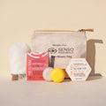 Kit viso nutriente anti-secchezza con mousse solida, siero antiage, guanto struccante e pochette naturale.