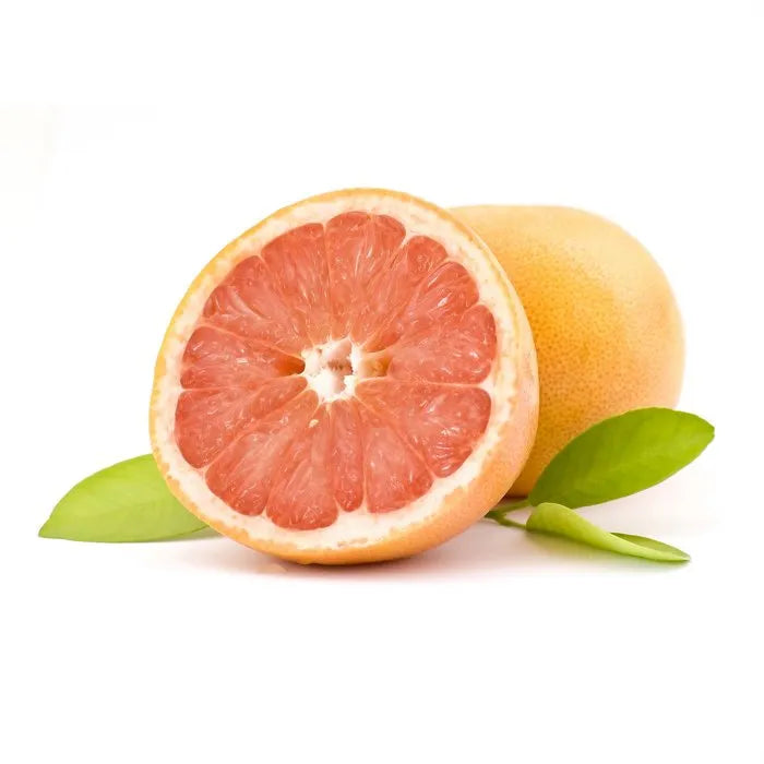 Olio essenziale di pompelmo con fette di pompelmo fresco