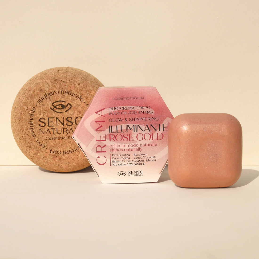 Olio solido corpo Rose Gold con contenitore in sughero, effetto shimmer dorato e texture vellutata.