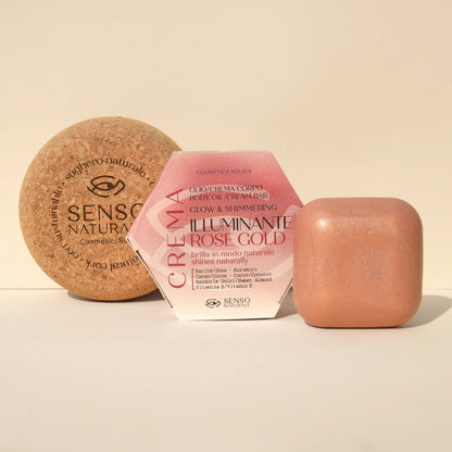 Olio solido corpo Rose Gold con contenitore in sughero, effetto shimmer dorato e texture vellutata.