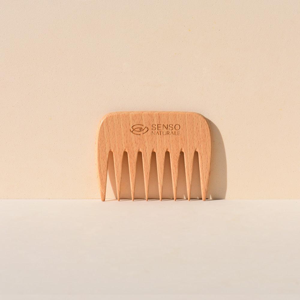 Wooden comb with wide teeth